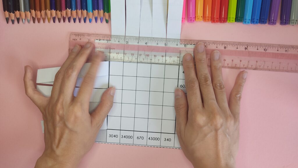 Use a ruler to press on the folded strips.