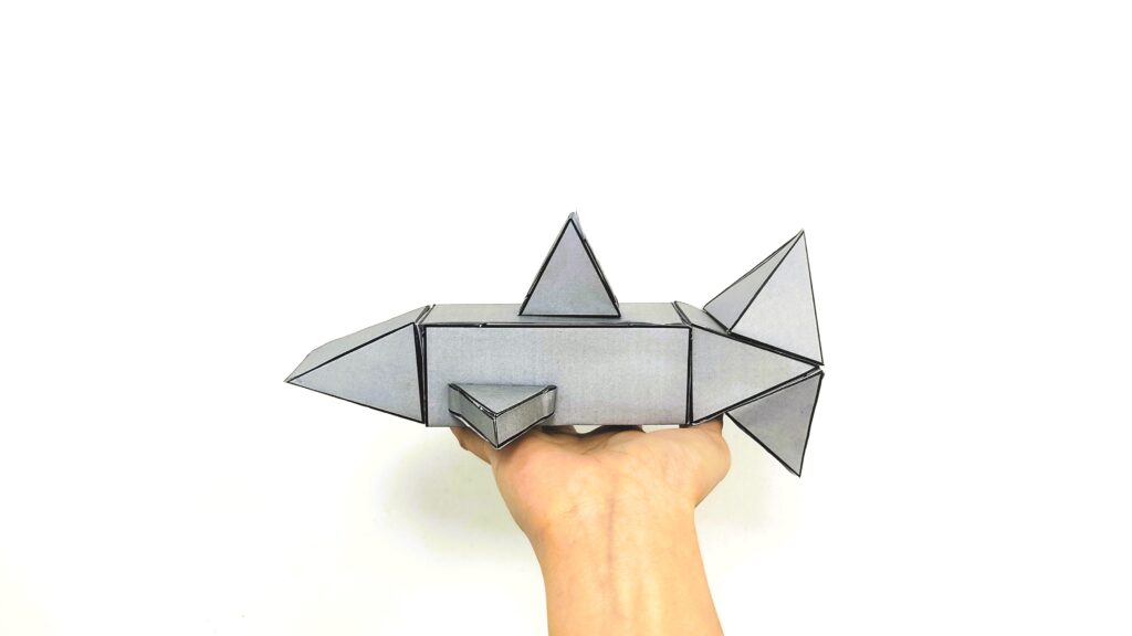 Use shark craft printable in storytelling as a shark puppet.