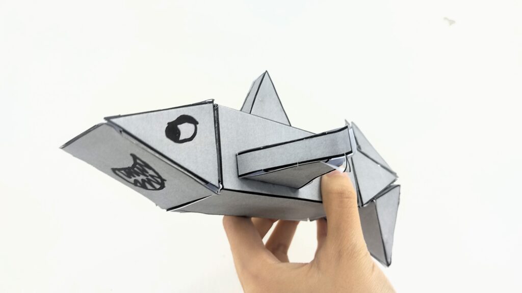 Shark craft printable with fierce expression can act as predator in the shark game.