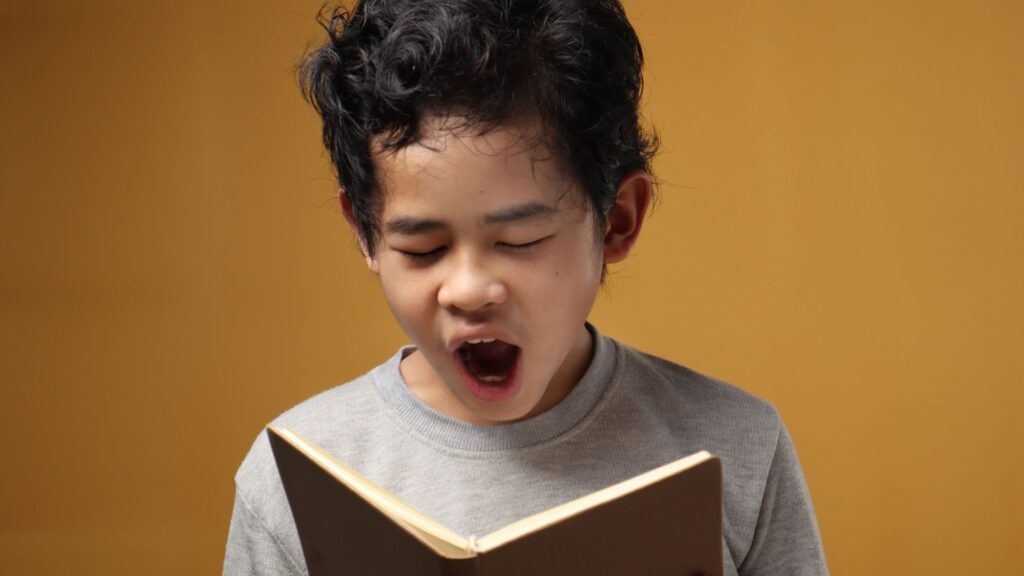 How to help distracted students - a tired boy still reading